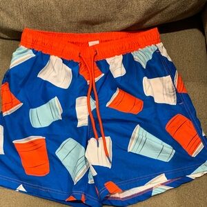 Never worn Celebrate It Vibrant Blue and Orange Swim Trunks